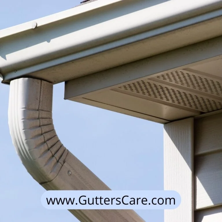 Home rain gutter system with a downspout attached to a house